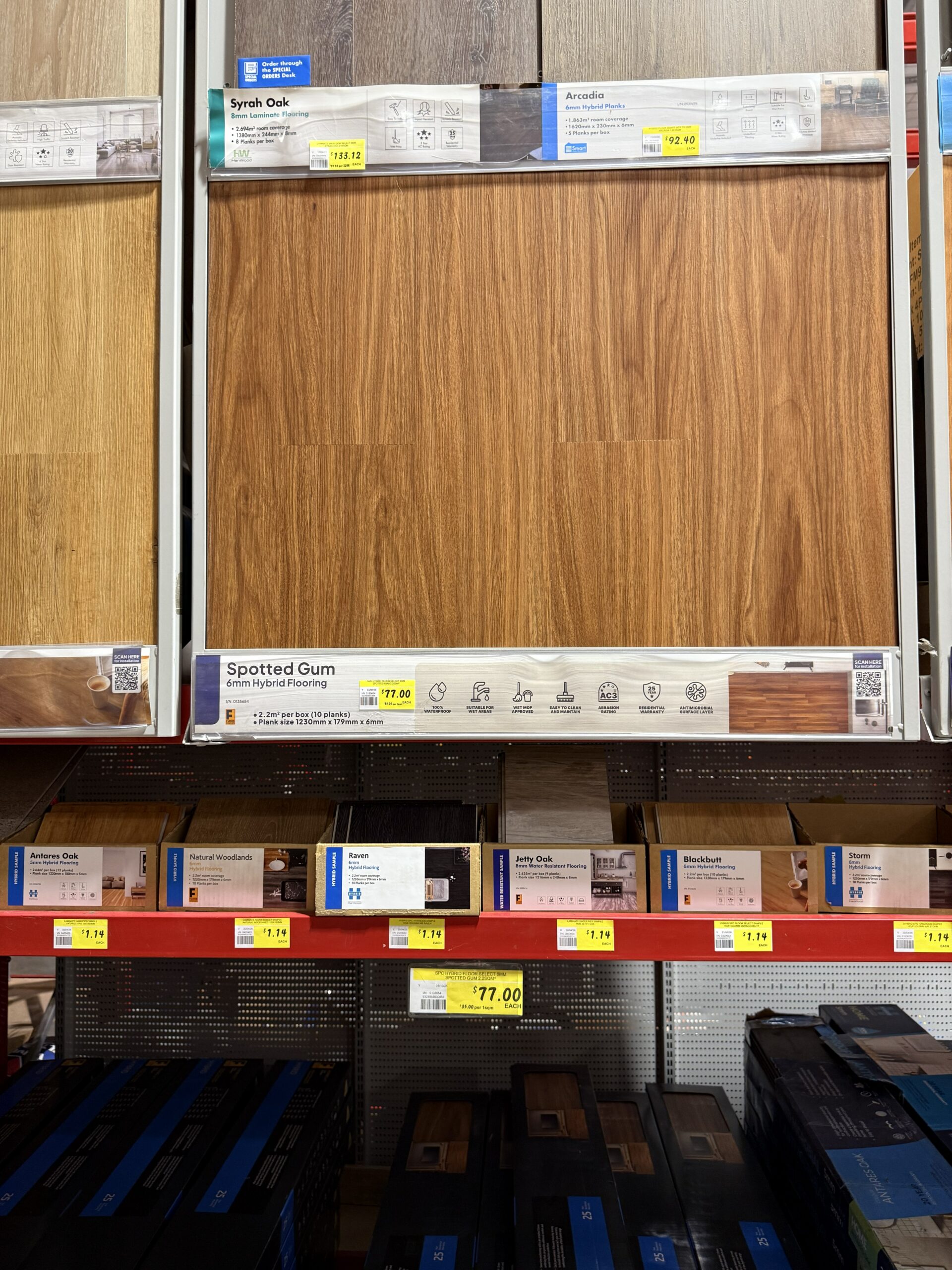 Floor Select Spotted Gum 6mm SPC hybrid flooring shelf display with price tag at Bunnings Coburg