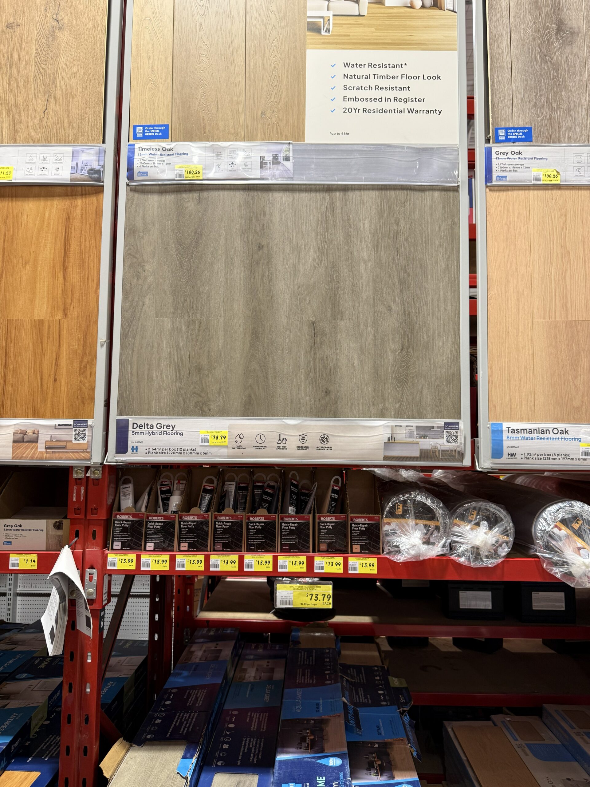 Hanwood Delta Grey 5mm SPC hybrid flooring shelf display with price tag at Bunnings Coburg